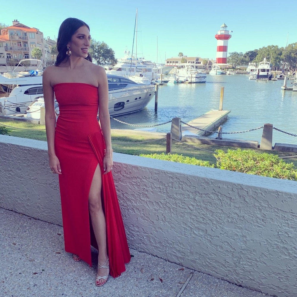 Solace London “Dolly” gown in a bright red-orange